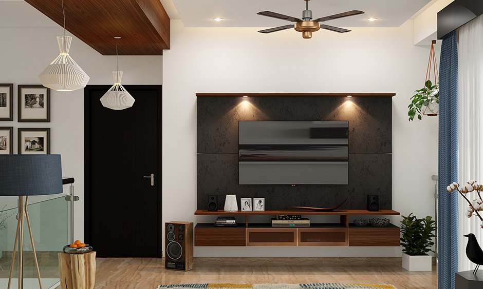 Entertainment unit incorporated with concrete wall panels for interior decoration