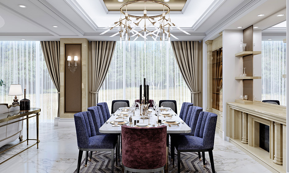 Cove gypsum false ceiling design with a large chandelier in the open-plan dining room
