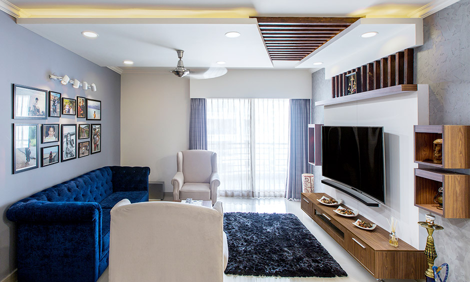 Living room with gypsum wood ceiling design adds visual interest to the space
