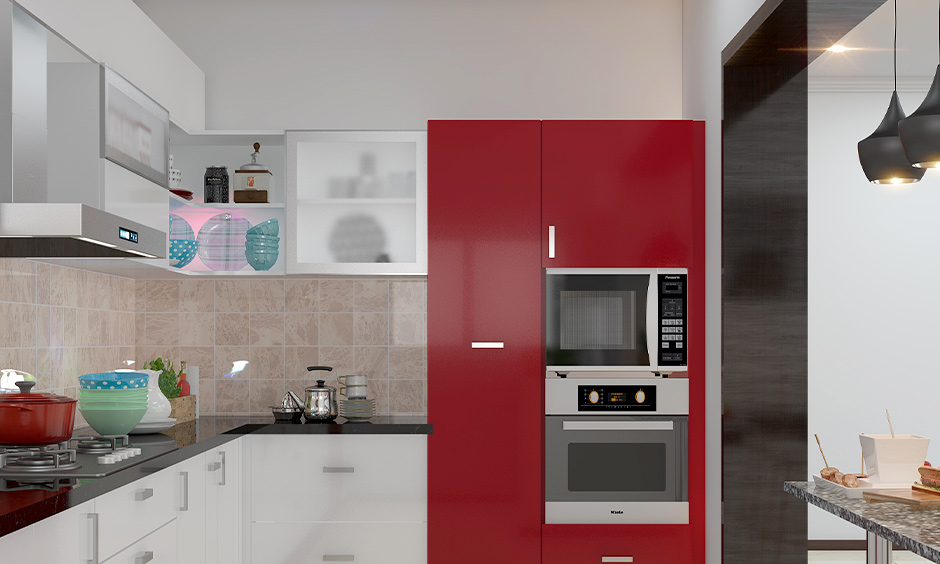Kitchen wall cabinet for oven and microwave in striking red colou