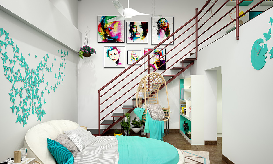 Studio apartment has a loft-style design with a minimalist bedroom interior and a staircase connecting two levels