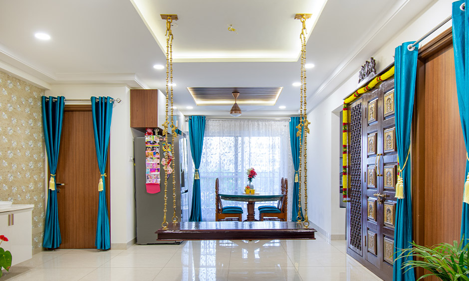 Polished wooden swing design with golden decorated chains