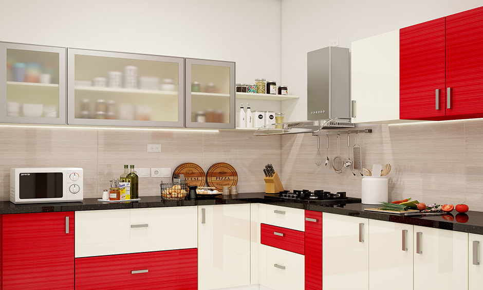 White kitchen with red accent represents energy and passion
