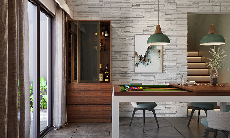 Dining game room with pool table having crafted wooden top