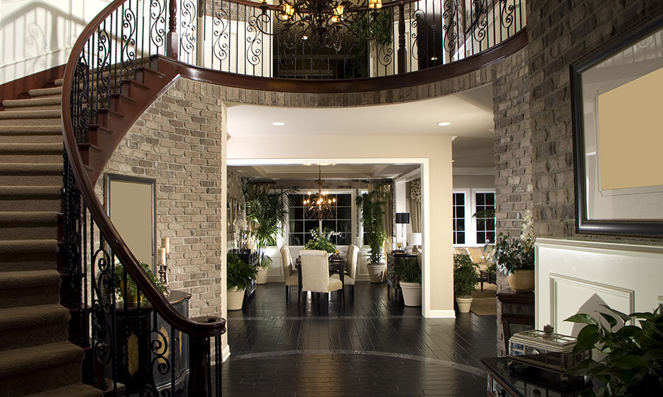 Duplex staircase has a heritage-inspired design featuring intricately grooved railings