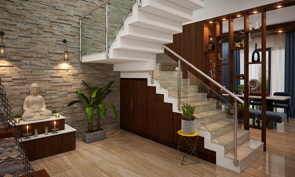 Duplex staircase with marble features glass panels that create a clean and spacious appearance