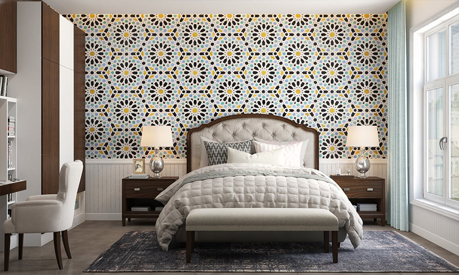 A Moroccan-inspired designer bedroom features an accent wall covered in Morocco tiles