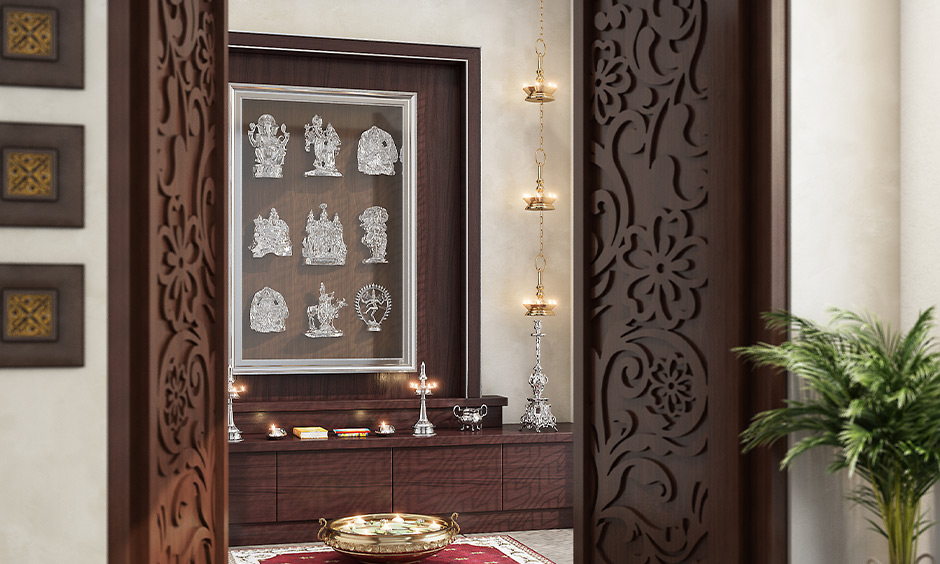 Simple pooja room door design in carved wood