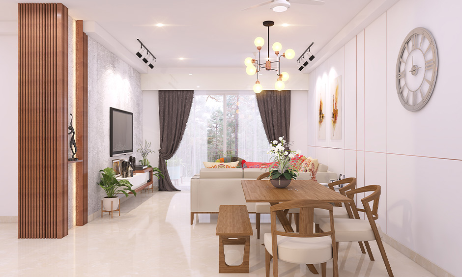 Open dining-cum-living room with traditional wooden dining chair design