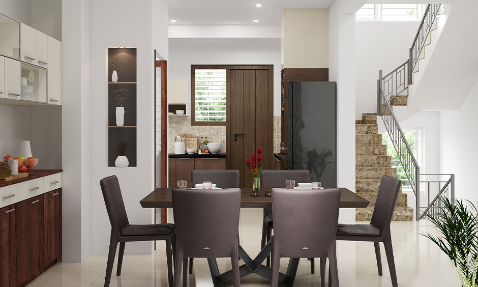 Trestle-style kitchen table is made of brown wood and has an X-shaped base