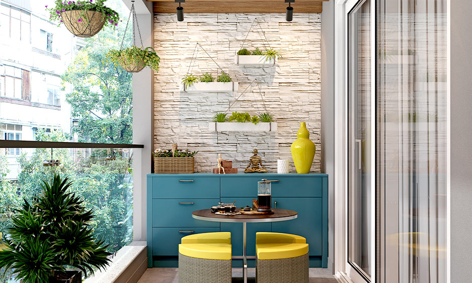 Outdoor coffee table with yellow ottomans as balcony storage solution