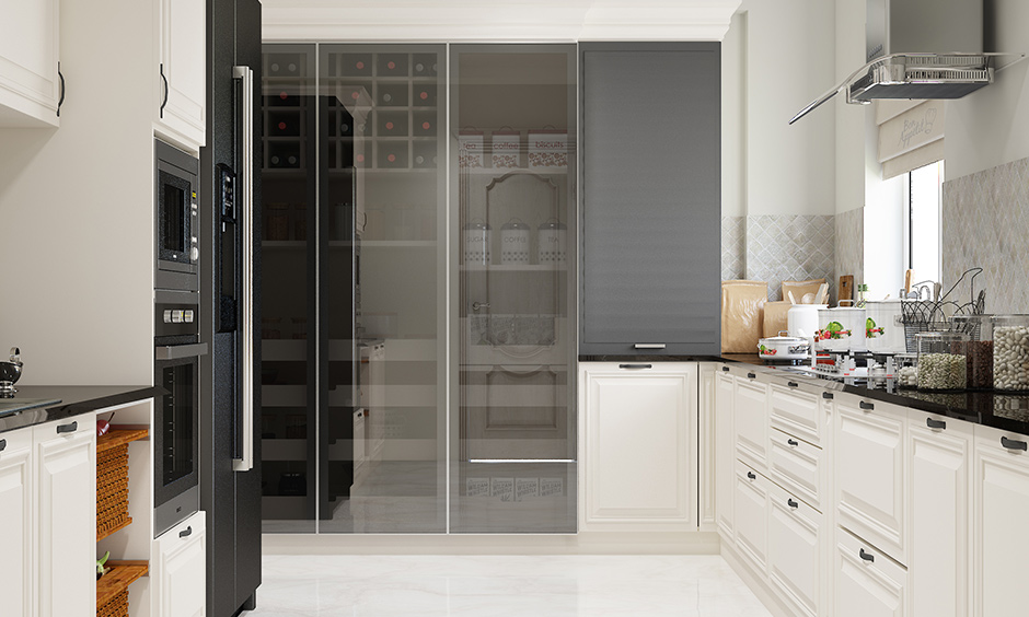 Mirrored hidden door in the kitchen is a practical and space-saving trick that creates an illusion
