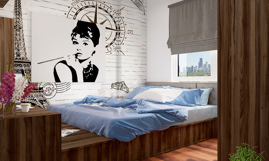 King-sized wooden bed with a unique design features an extended platform and table