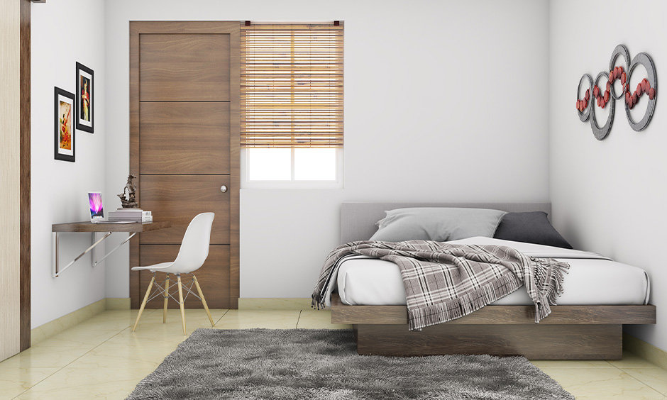 Mid-century modern floating bed frame with clean lines and tapering legs, creating a focal point in the bedroom