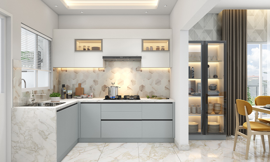 White colour kitchen cabinet with a glass crockery unit for luxurious vibe