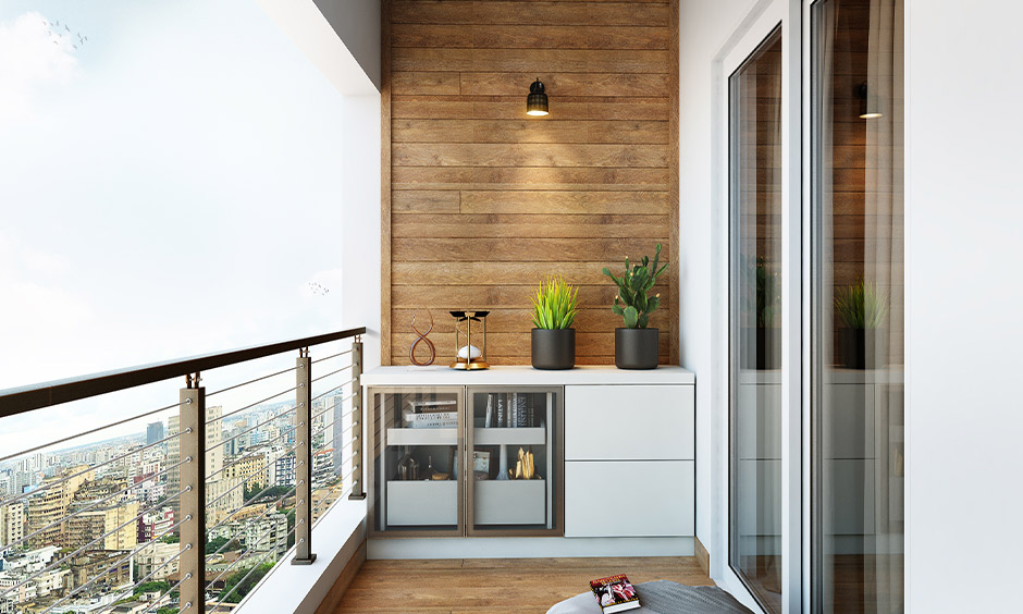 Balcony decor with diy reading nook features a simple cabinet stacked with books and floor cushions