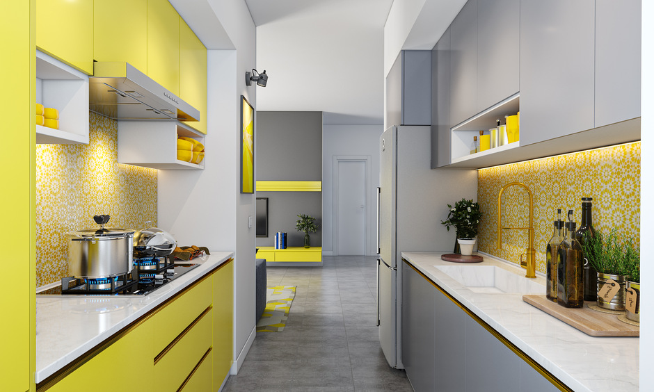 Copper kitchen sink faucet pairs brilliantly with the yellow kitchen backsplash