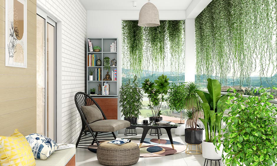 DIY balcony privacy screen for glass railing with trailing plants creates a natural green curtain
