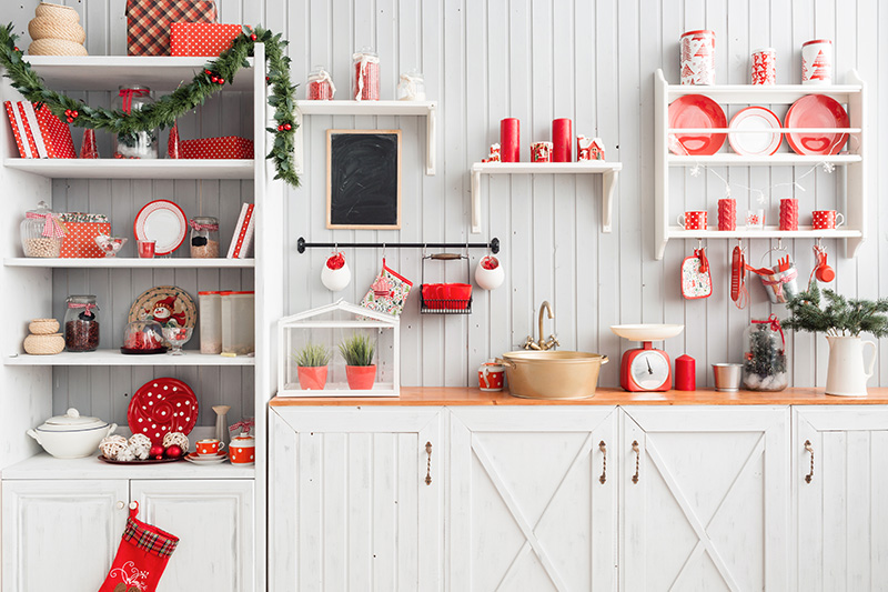 Christmas kitchen cabinet decoration with sprigs or garlands