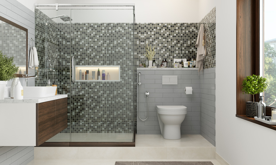Classic mosaic bathroom tiles in black, white, and grey bring back timeless elegance