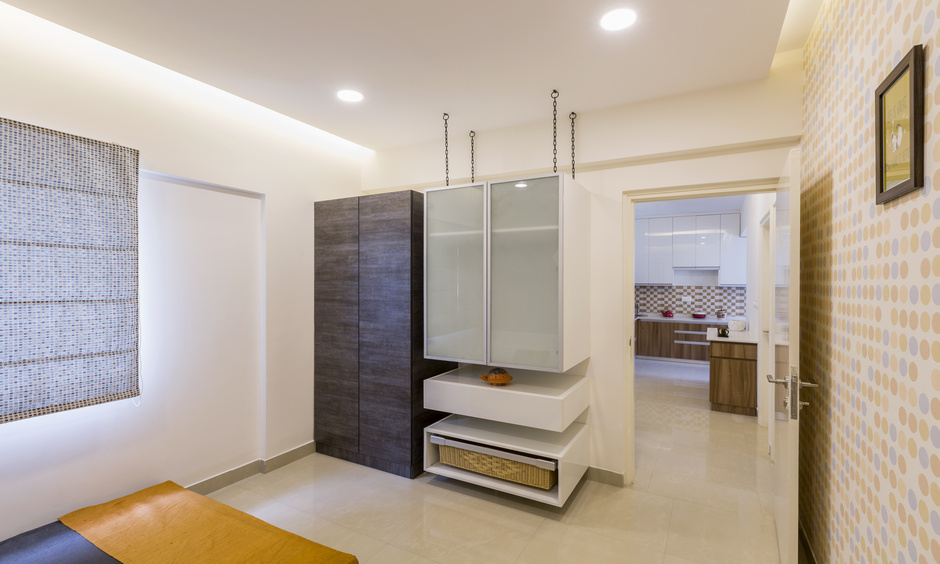 Designer bedroom cabinet design with recessed ceiling lights