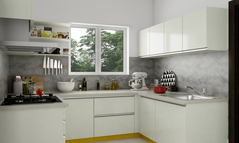 Inset steel handles for modern kitchen cabinets offer a minimalistic accent