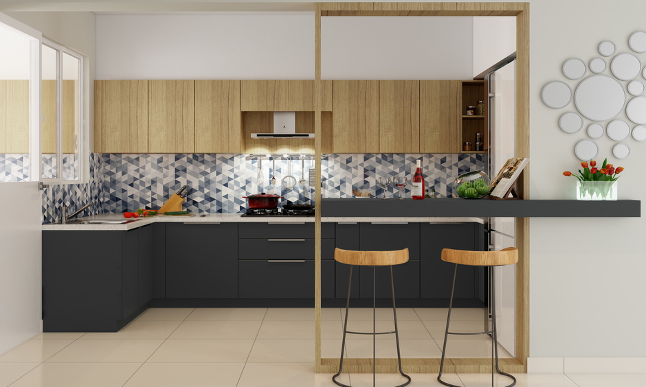 Triangular blueish-grey and white mosaic tile pattern backsplash in kitchen