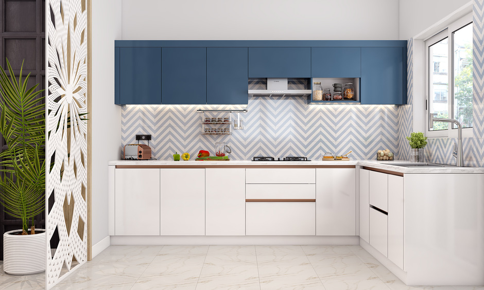 Hall to kitchen entrance design with white Jali partition