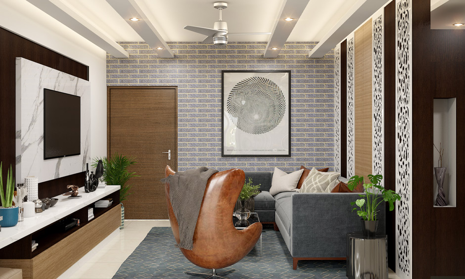 Small drawing room interior design with a built-in TV cabinet works as a wall accent