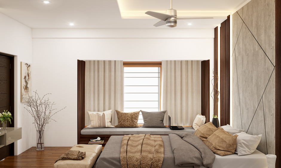 Small master bedroom interior integrated with a stylish wall that doubles up as a bed back