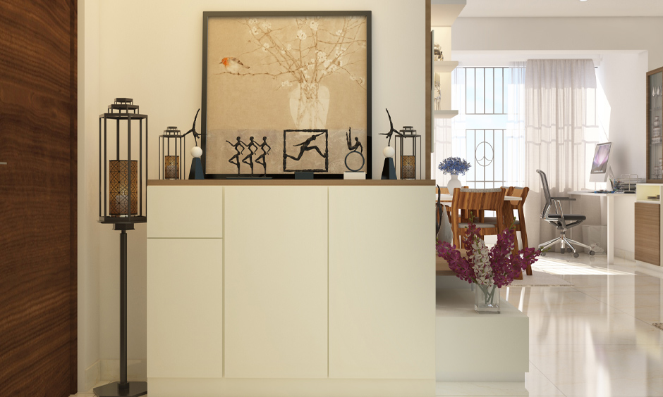 Soft cream laminate console table with shoe storage ensures the entrance remains clutter-free