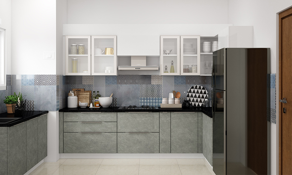 Kitchen dado tiles in shades of blues, whites, and greys that are inspired by patchwork