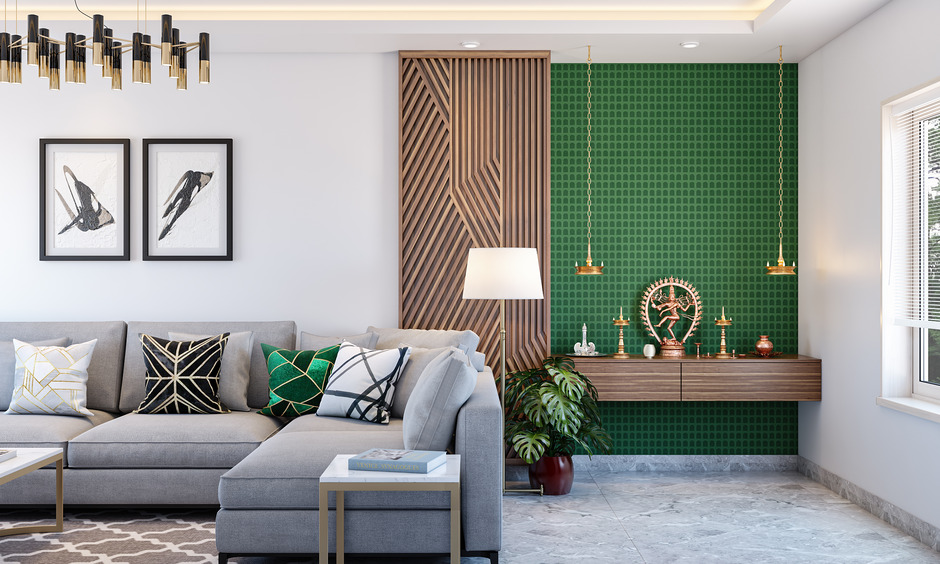 Small pooja room design in hall has a backdrop of green tiles