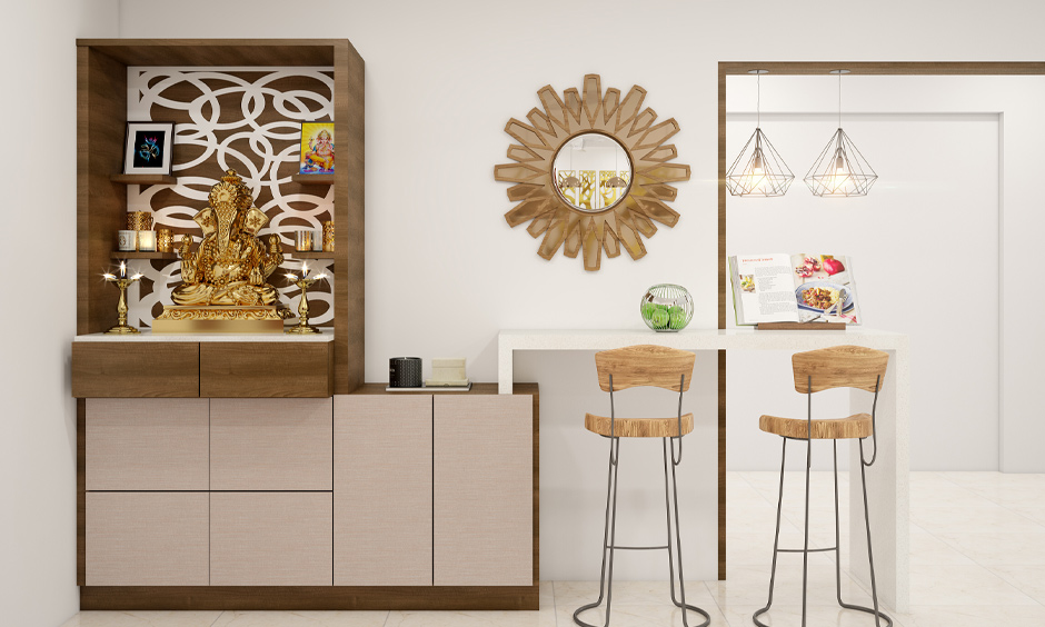 Symmetrical small pooja room design in hall maximises space utilisation