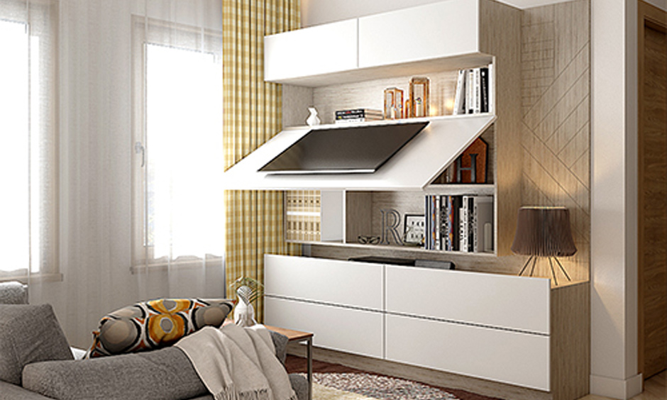 Corner wall TV stand with hidden storage behind a flip-up shutter