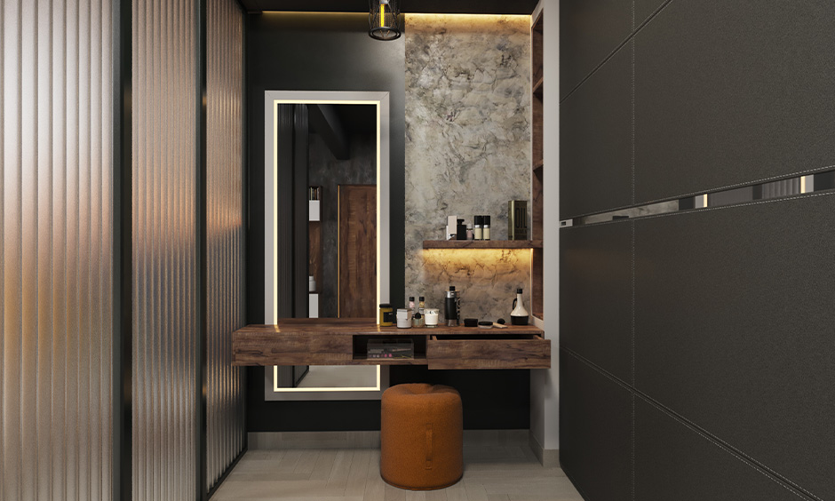 Dark-toned dressing table design with storage and a full-length mirror