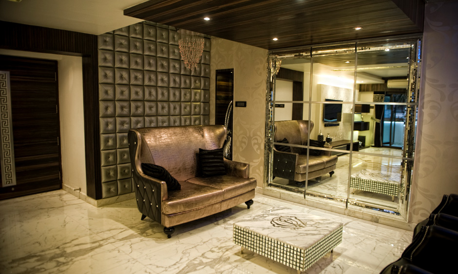 Living room wall mirrors in square-cut frames offer a panoramic view of the space