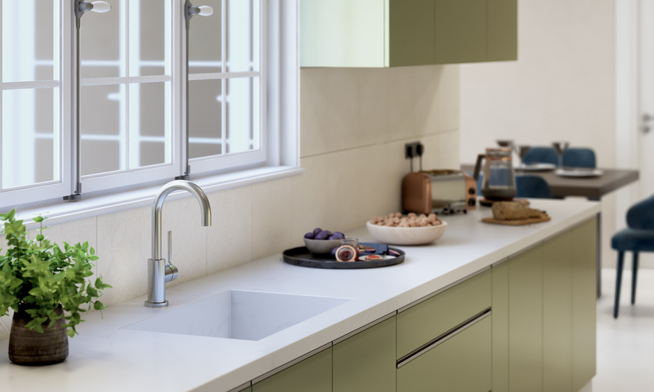 Modern kitchen sink finished in white marble with a deep single bowl