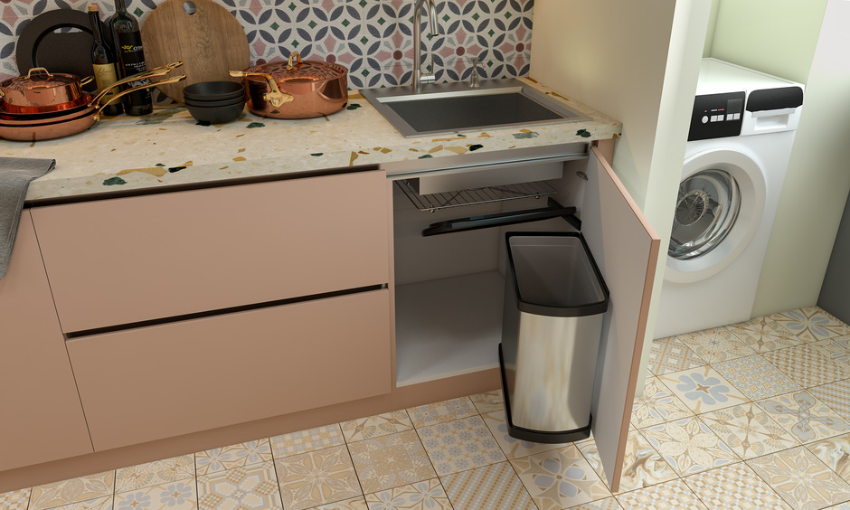 Modern stainless steel kitchen sink features a base cabinet with pull-out bins