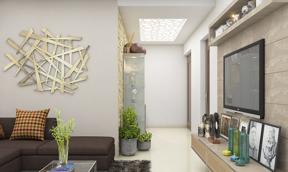 Simple false ceiling design for a hall with back-lit panels