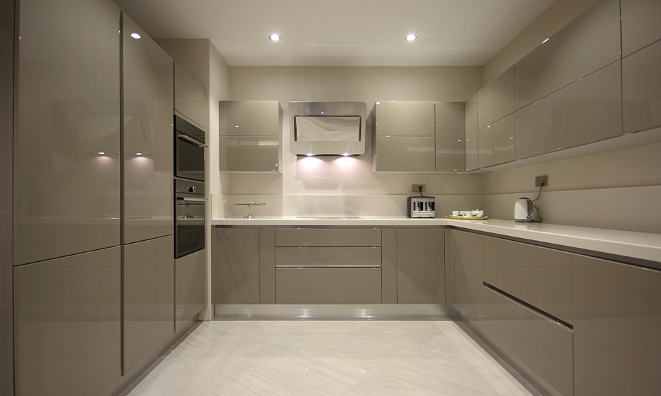 Kitchen cabinets in high gloss laminate colour in medium grey