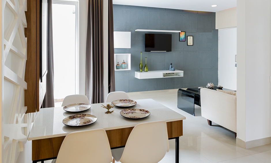 White pearl granite-topped dining table with four chairs