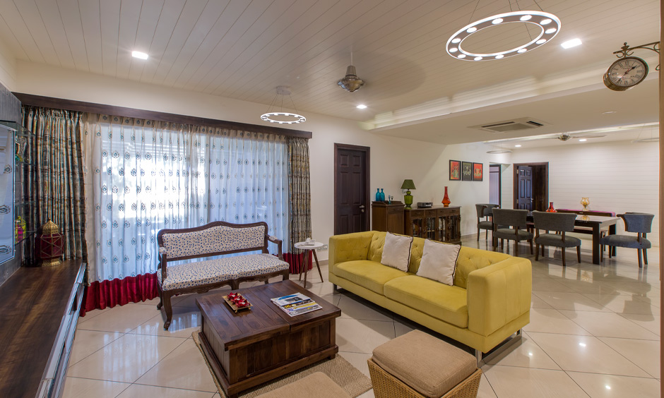 Yellow and white drawing room colour design creates a clean and comfortable look
