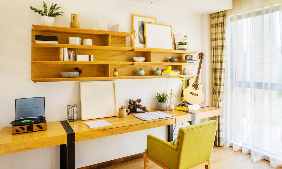 Floating shelves designed in tulip tree colour create visual harmony in the study room