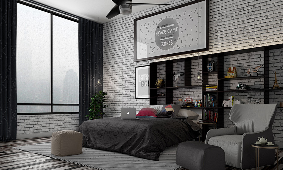 Industrial brick wall bedroom decor paired with hardwood flooring complements the space