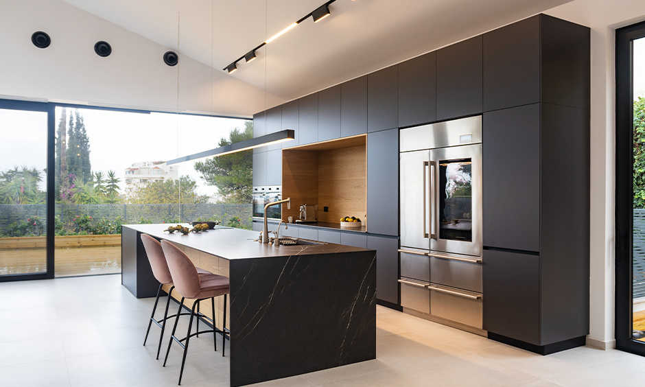 Luxury kitchen appliance setup features built-in ovens, touch controls, and convenient appliance garages for easy storage.