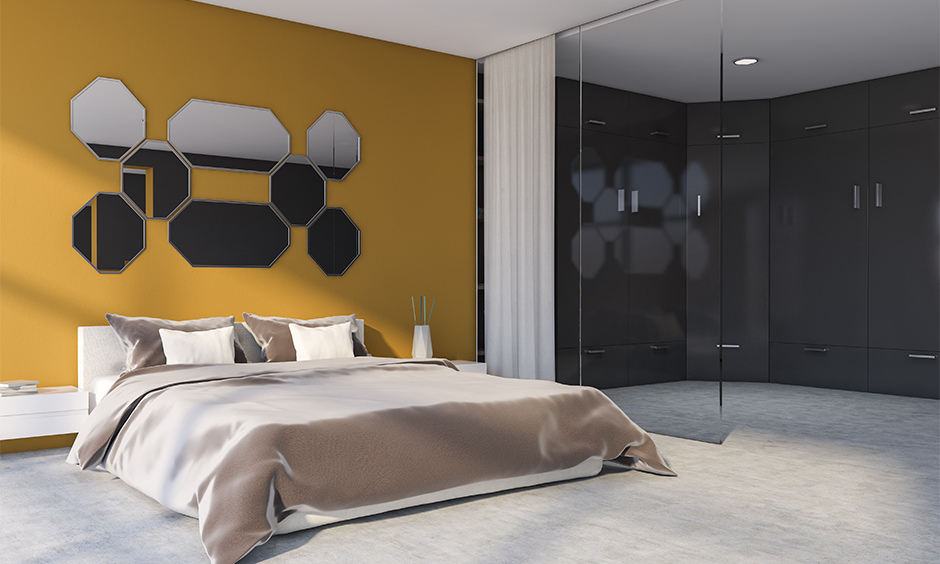 Yellow master bedroom colour combination with mirrored accents for a warm look