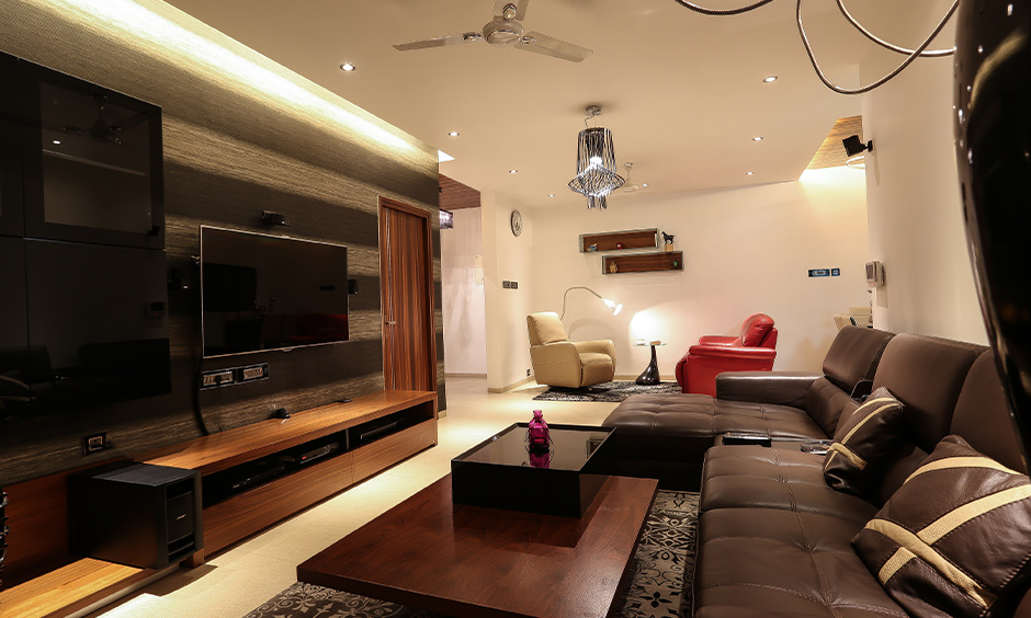 Glass and wooden tea table design for a brown-themed living room