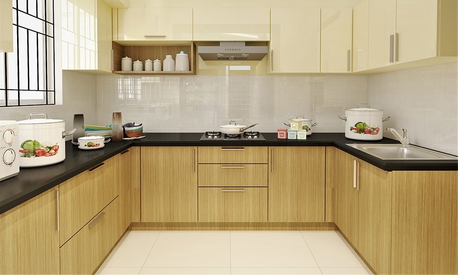 Simple kitchen design Indian style embraces a light-toned colour palette featuring beige, white, and brown.