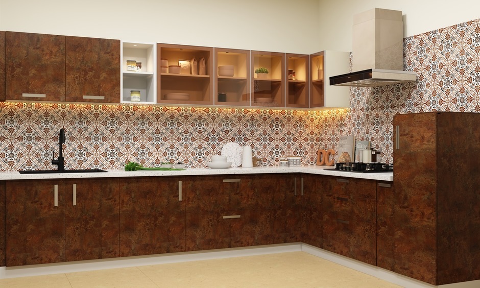 Dark brown kitchen cabinet ideas which have warm underlights to brighten the space